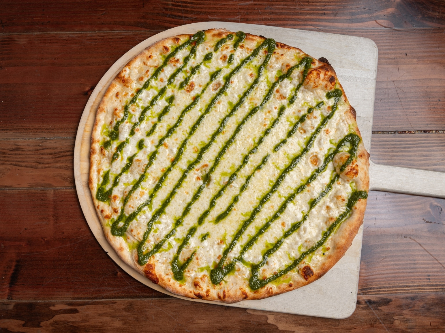 Leonardo Pizza Topping Combinations Mozzarella, homemade pesto, Parmesan cheese,