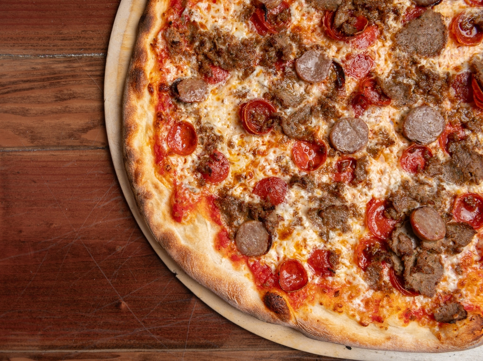 MeatLovers Sopranos pizza toppings Tomato Sauce, Mozzarella, Pepperoni, Italian Sausage, Meatballs.